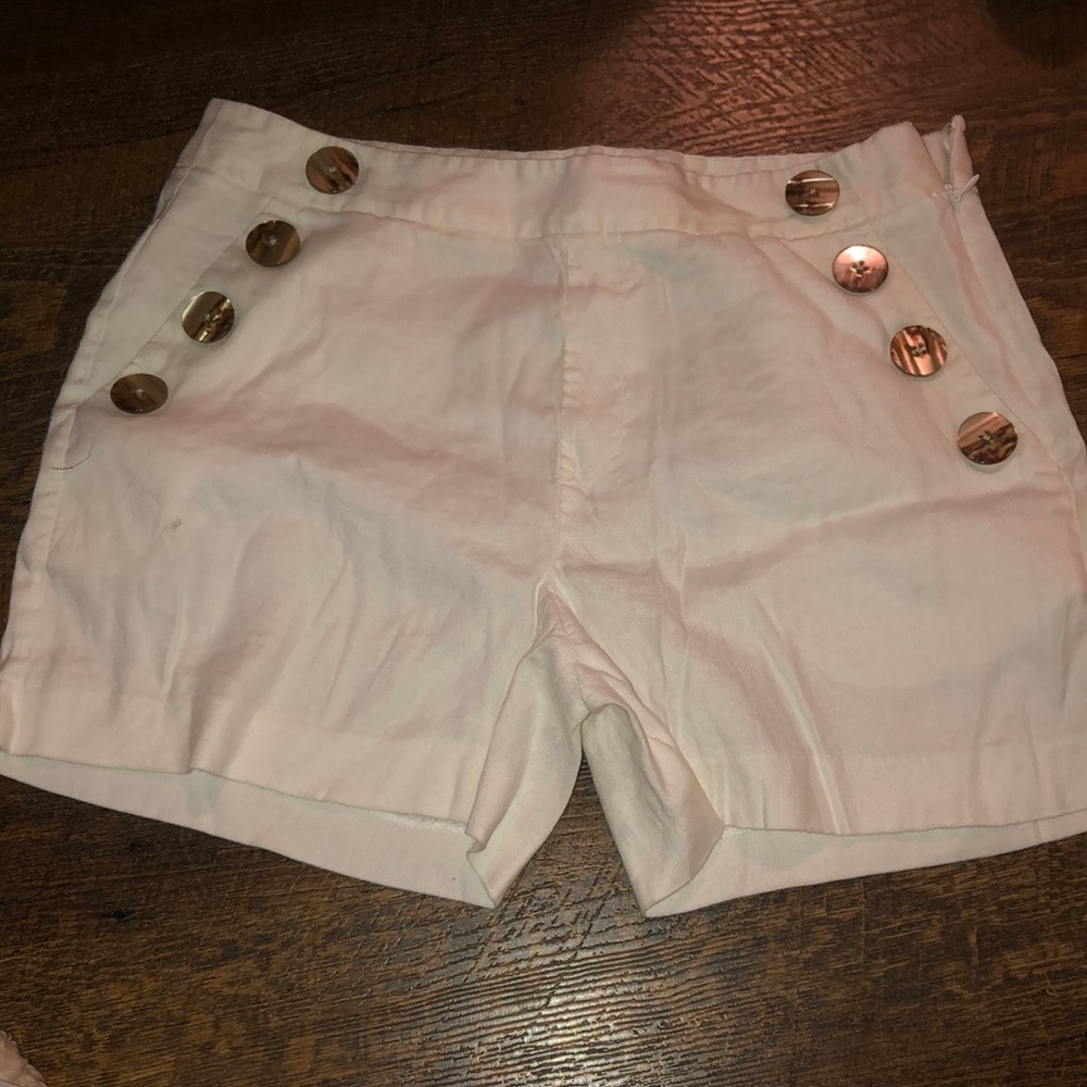 white buttoned shorts